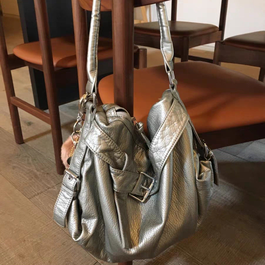 Vintage motorbike leather shoulder bag in Silver, hanging view