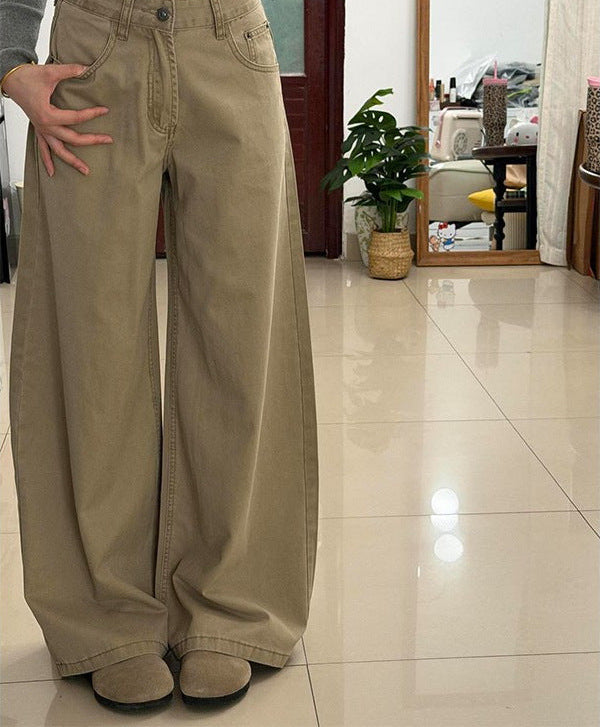 Khaki high-waisted wide-leg stretch jeans, hand on hip