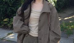 Stand collar drawstring short trench coat, worn open