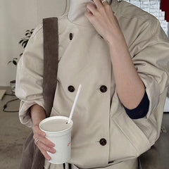 Double-breasted cropped trench jacket in beige, front view