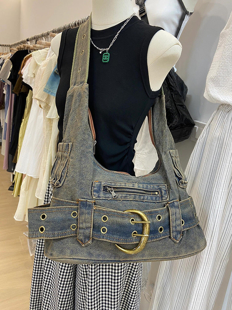 Retro washed denim shoulder bag in denim blue, on a mannequin
