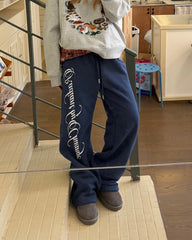 Printed fleece cuffed sweatpants in blue, styled