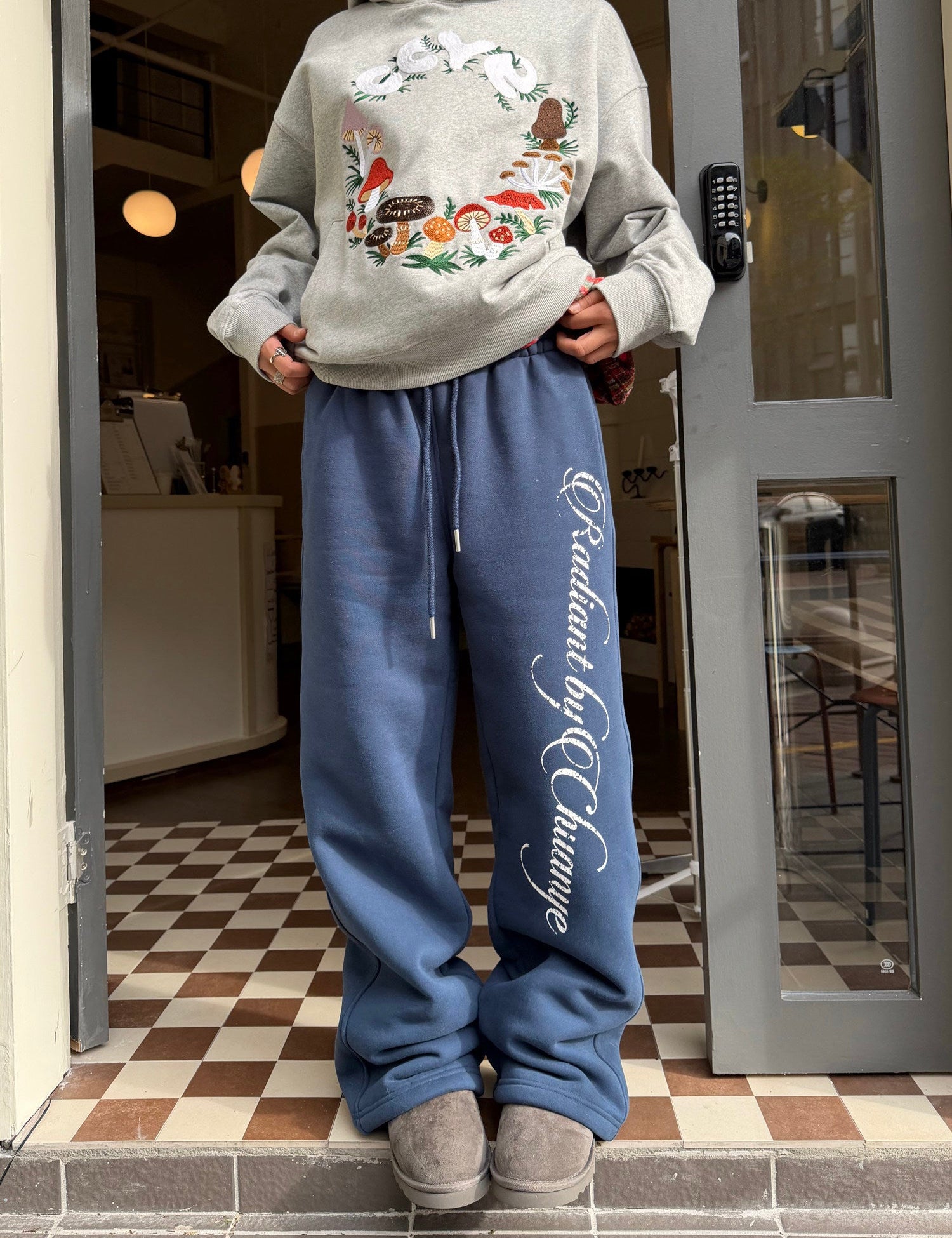Printed fleece cuffed sweatpants in blue, front view