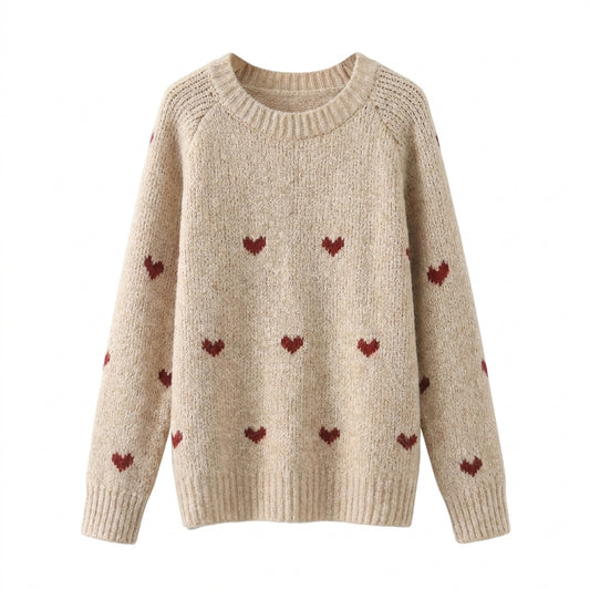 Beige sweater with red heart patterns on a white background