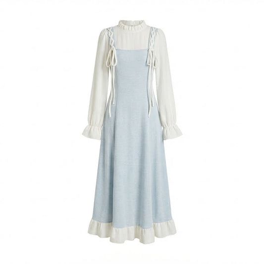 Light blue dress with white long-sleeve top on a white background