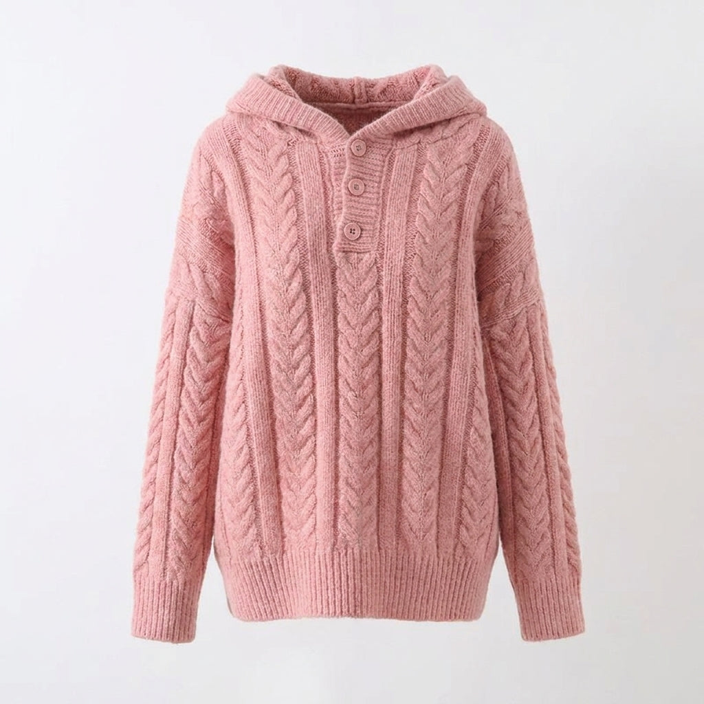 Pink knitted hoodie on a light gray background