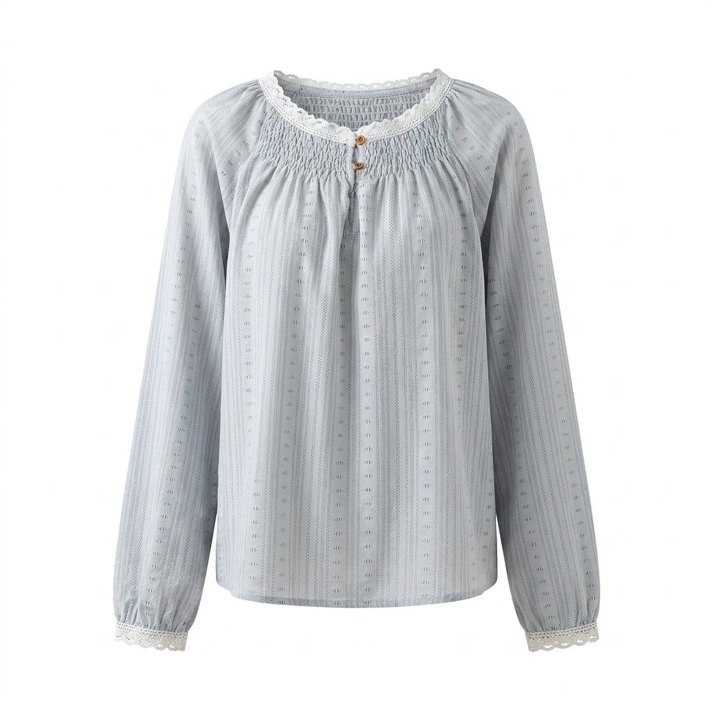 Light blue blouse with long sleeves on a white background
