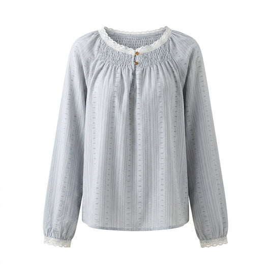 Light blue blouse with long sleeves on a white background