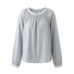 Light blue blouse with long sleeves on a white background