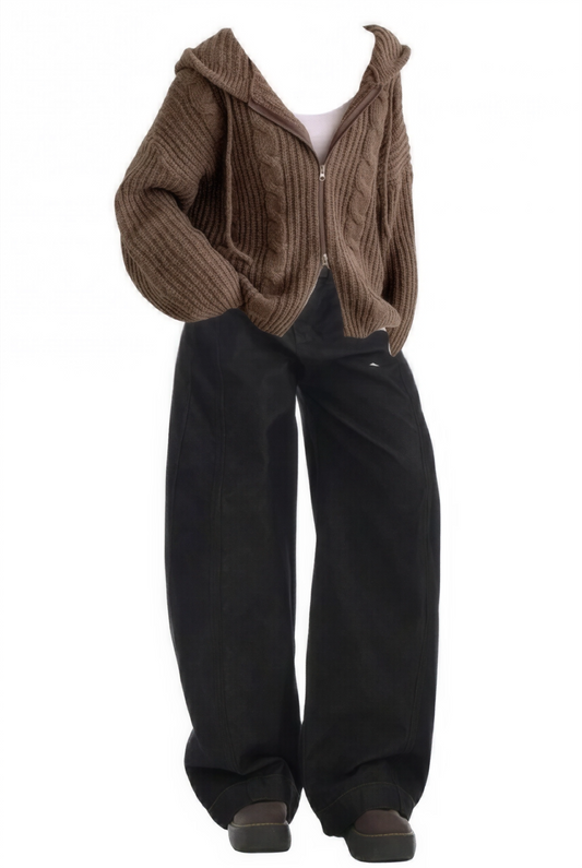 Brown knitted cardigan over a white shirt with black pants on a white background