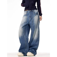 Person wearing wide-leg jeans on a white background