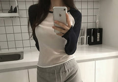 Color-block knit sweater top in black white, front view