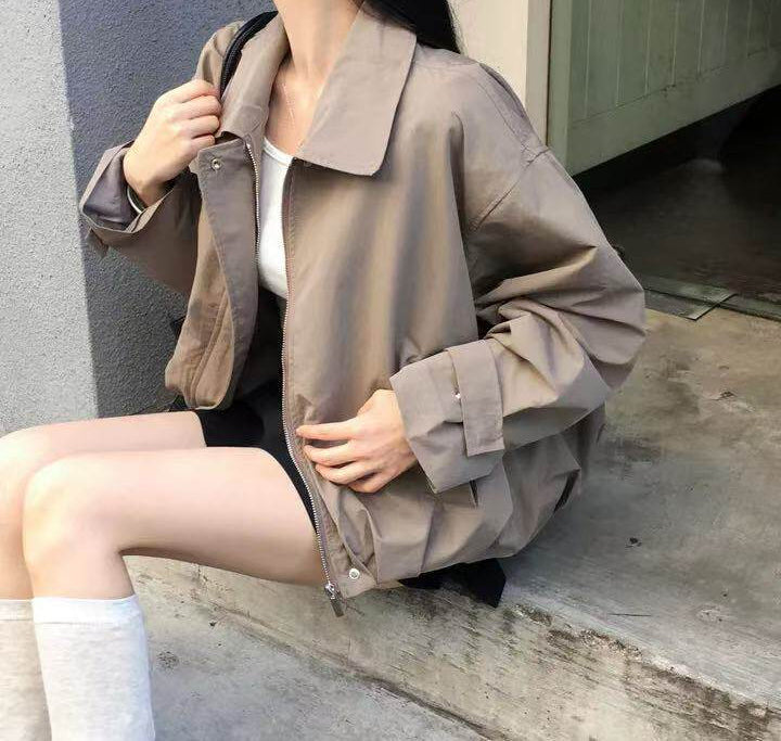 Lapel loose-fit short trench coat in Khaki, seated view