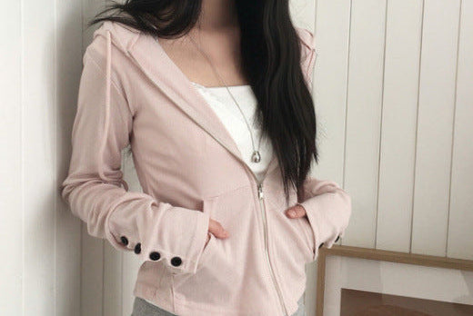 Butterfly sleeve hooded knit sweater in Pink, hands in pockets