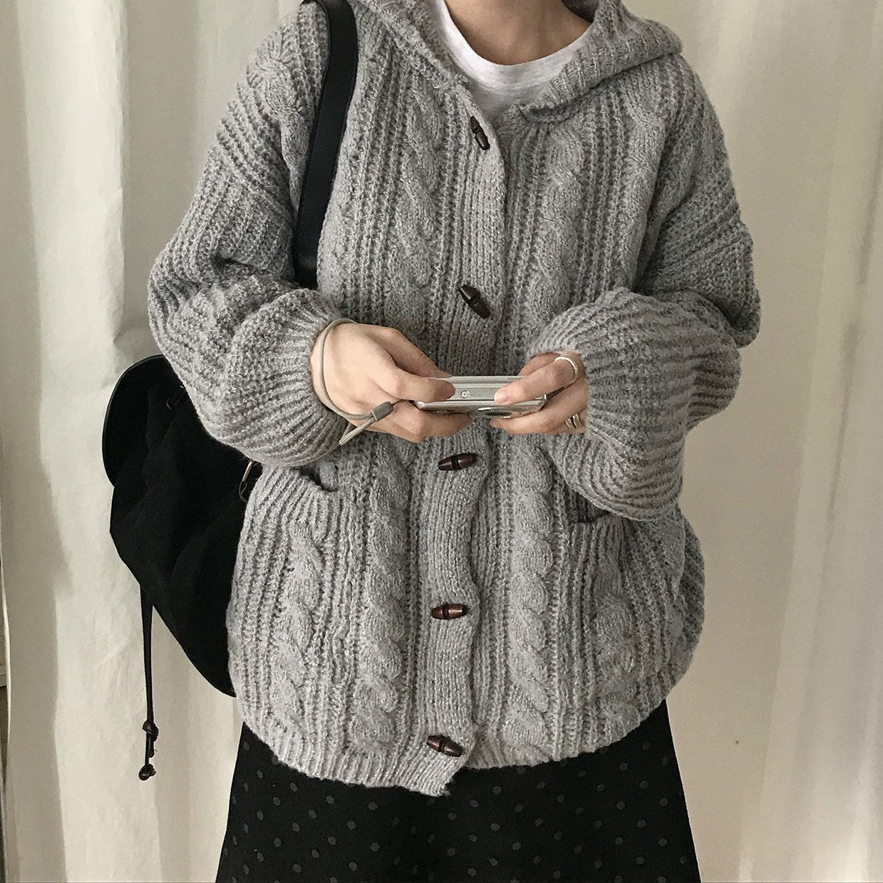 Oversized hooded cable knit cardigan in gray, front view