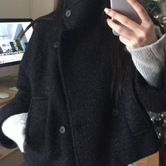 Loose quilted jacket with fluffy trim in black, front view