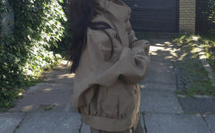 Stand collar drawstring short trench coat, side view with gathered hem