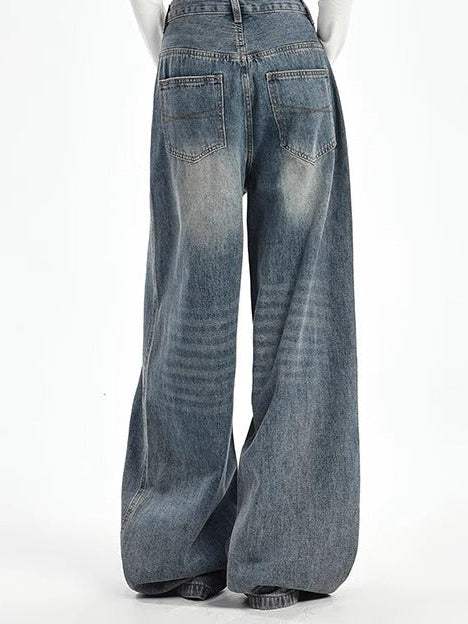 Plus size high-waist wide-leg jeans in vintage blue, back view