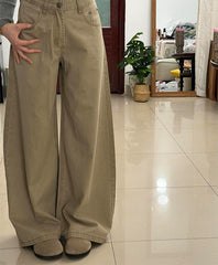 Khaki high-waisted wide-leg stretch jeans, hand on hip