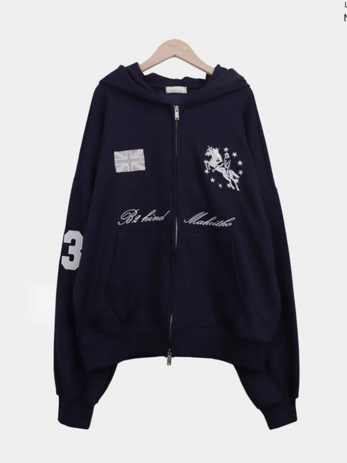 Embroidered oversized zip-up hoodie in navy blue, product shot