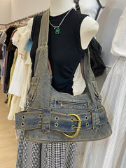 Retro washed denim shoulder bag in denim blue, on a mannequin