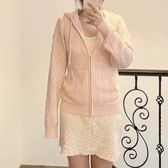 Women's hooded cable knit pullover with zipper opening