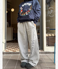 Printed fleece cuffed sweatpants in gray, side print detail