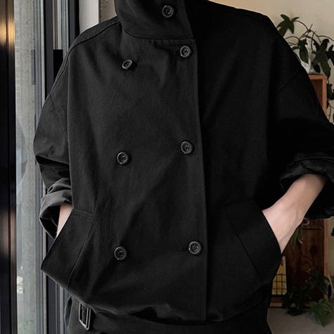 Double-breasted cropped trench jacket in black, front view