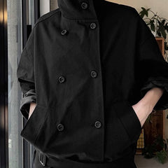 Double-breasted cropped trench jacket in black, front view