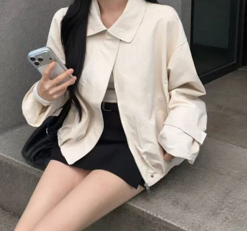 Lapel loose-fit short trench coat in Light Apricot, seated view