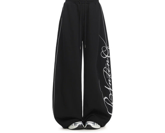 Embroidered wide-leg sweatpants in black, drawstring waist