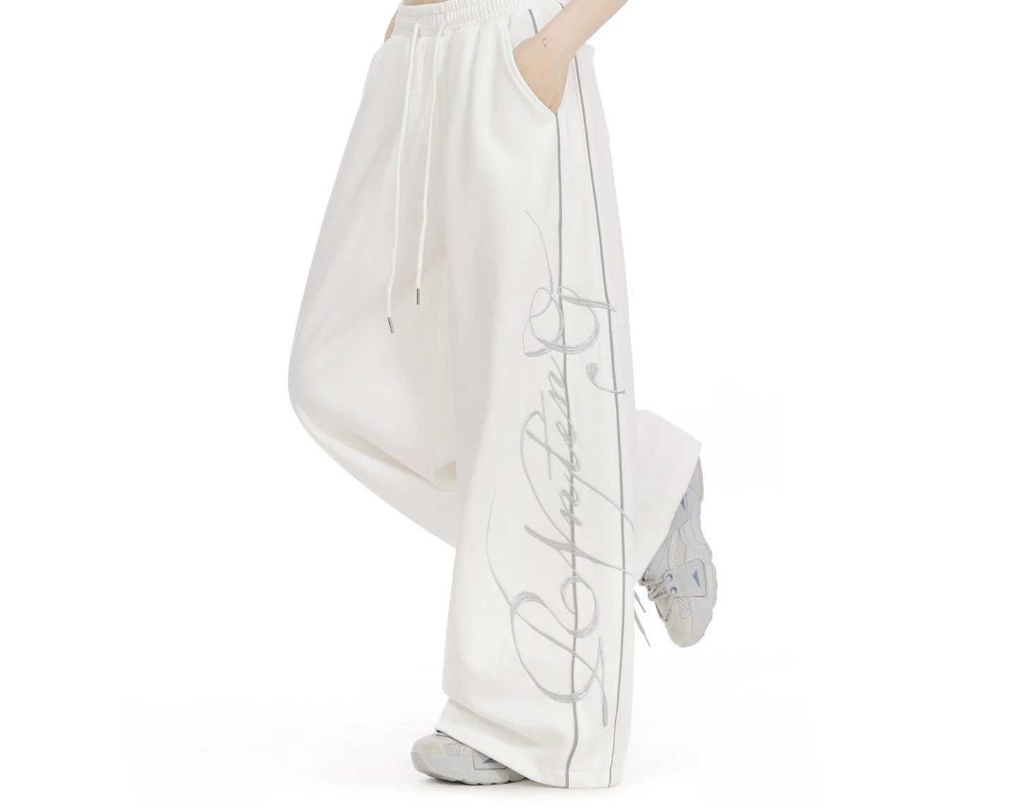 Embroidered wide-leg sweatpants in white, side view