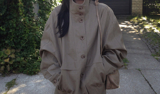 Stand collar drawstring short trench coat, hands in pockets
