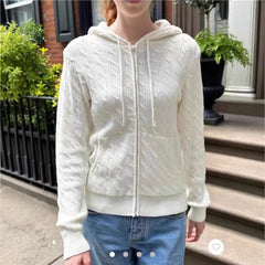 Women's hooded cable knit pullover with zipper opening