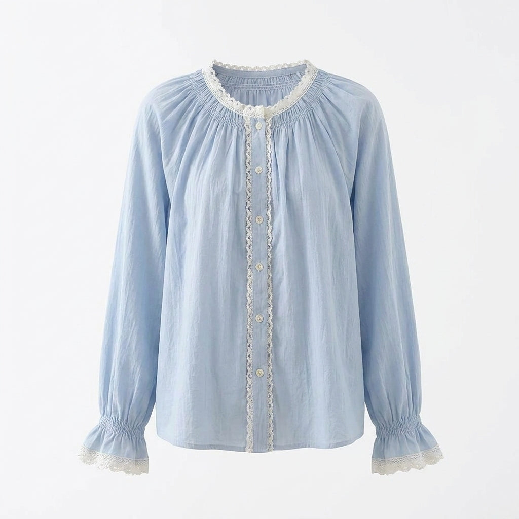 Light blue blouse with lace details on a white background