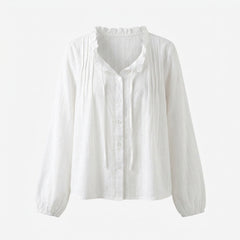 White blouse with long sleeves on a white background
