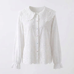 White lace blouse on a light gray background