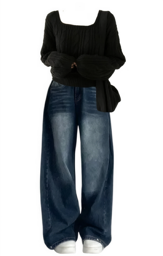 Black top and blue jeans on a white background