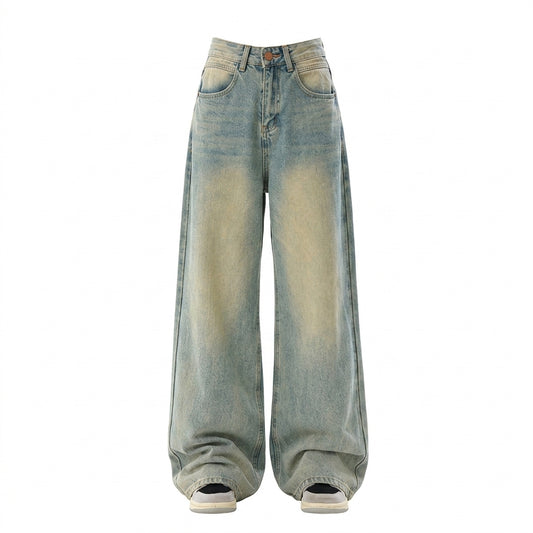 Wide-leg light blue denim jeans with a faded yellowish wash on the front, shown on a plain white background.