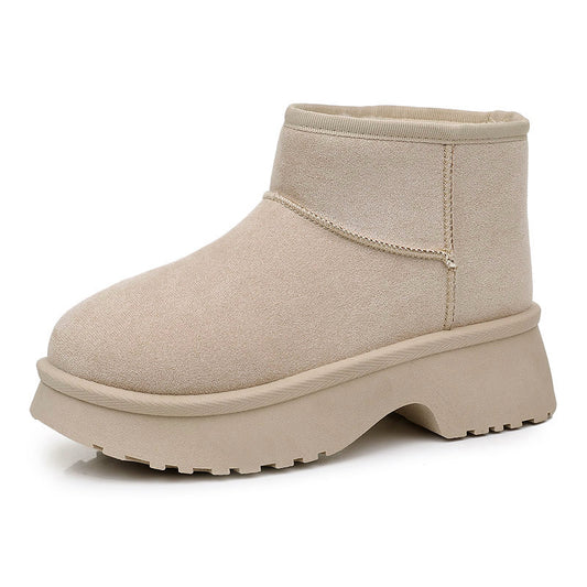 A single beige ankle boot with a chunky platform sole, shown from a side profile on a white background.