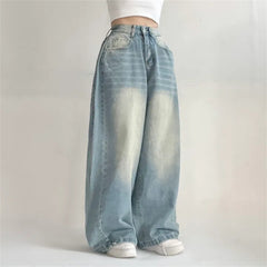 Light blue jeans worn by a person on a plain background