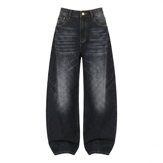 A pair of dark washed denim jeans with a high waist and wide, baggy legs, shown flat against a solid white background.