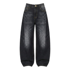 A pair of dark washed denim jeans with a high waist and wide, baggy legs, shown flat against a solid white background.