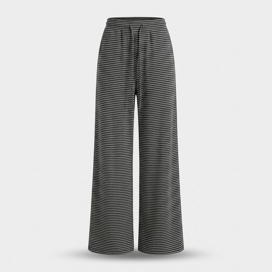 A pair of wide-leg pants with a black and gray horizontal striped pattern, shown against a light gray background.