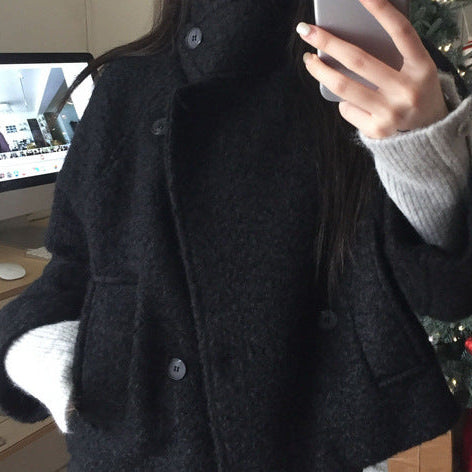 Loose quilted jacket with fluffy trim in black, front view