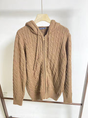Women's hooded cable knit pullover with zipper opening