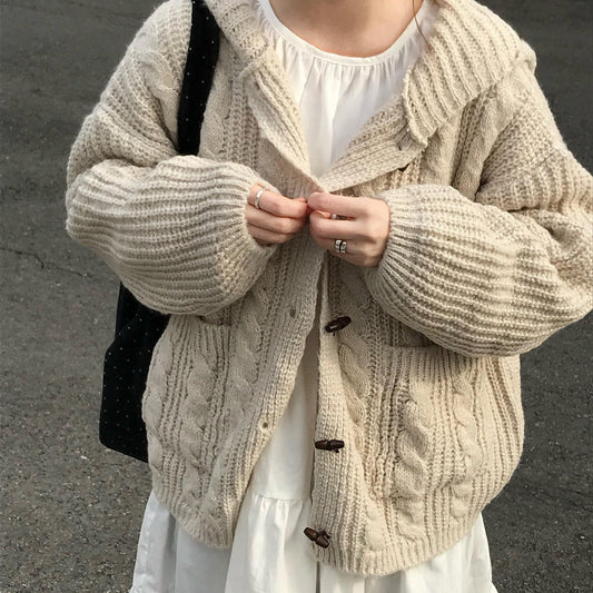 Oversized hooded cable knit cardigan in beige (Mi Xing), front view