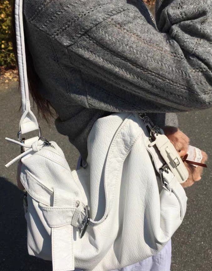 Vintage motorbike leather shoulder bag in White, worn on the shoulder